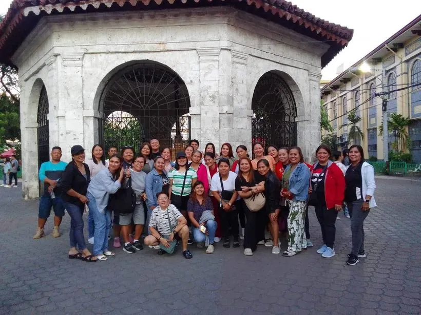 A tour group gathered in front of Magellan's Cross in Cebu City