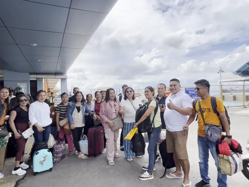 A tour group with their luggage just after landing